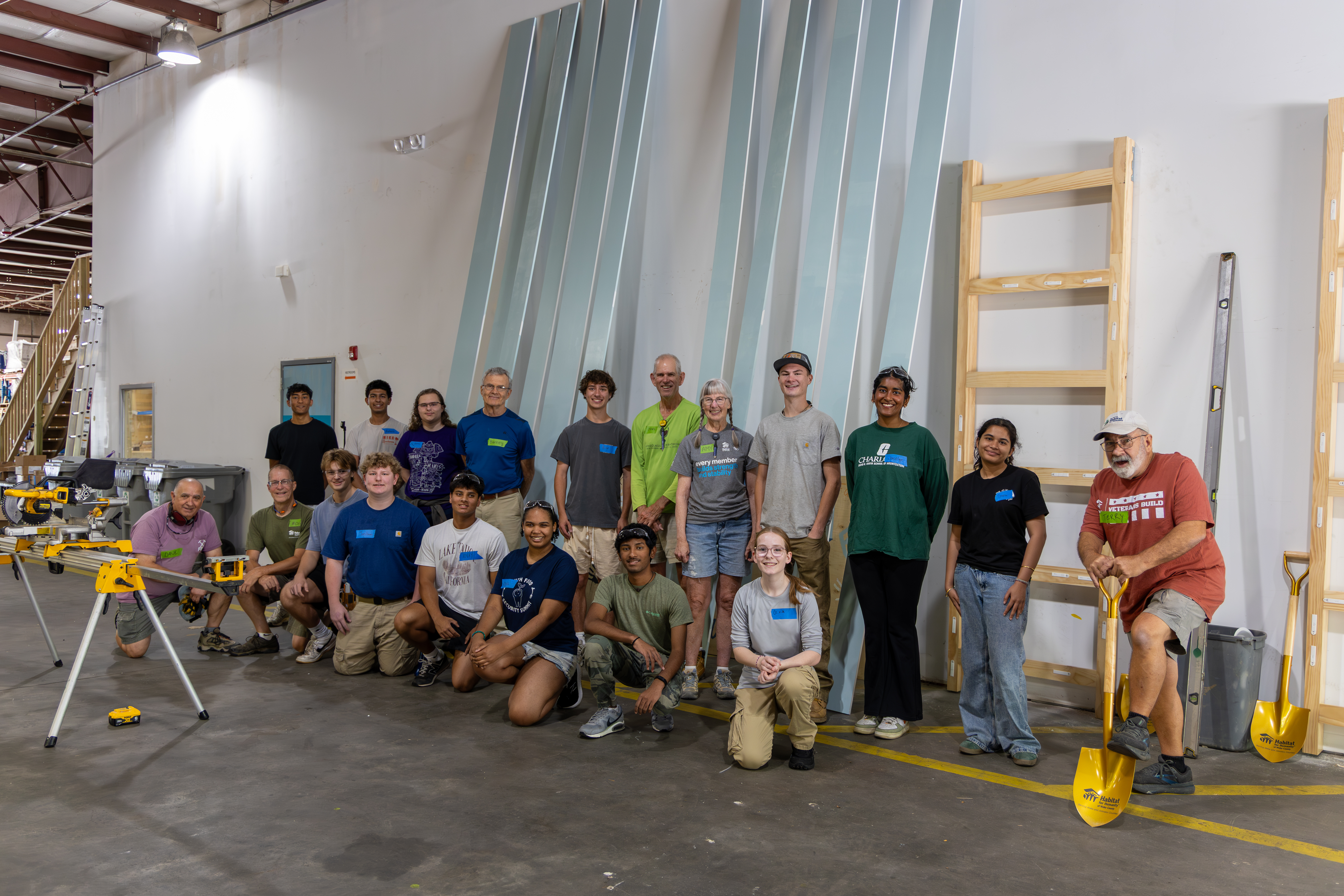 Summer of service interns pose with force of habitat volunteers during orientation week