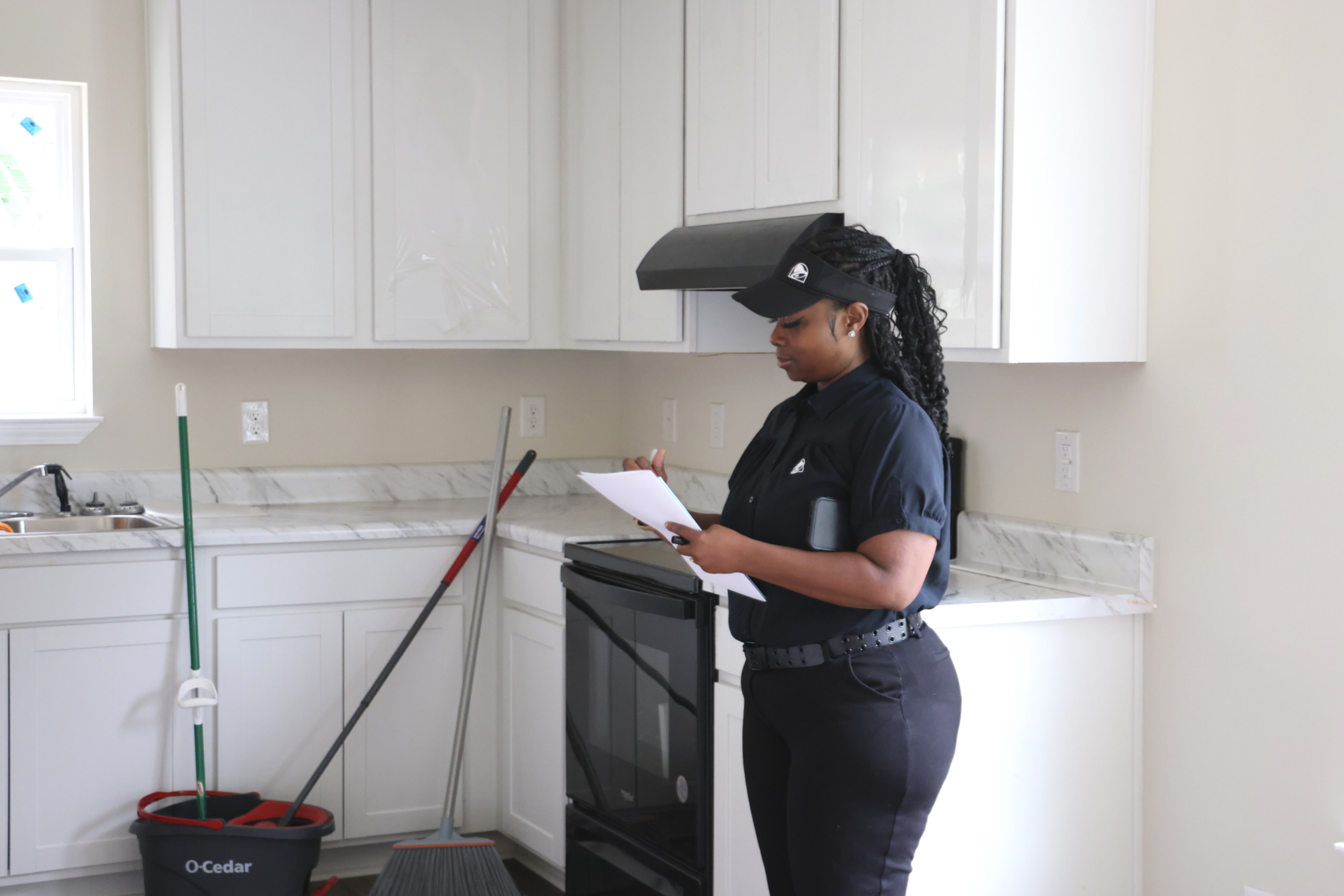 Habitat homebuyer takes notes on a floorpan she might purchase