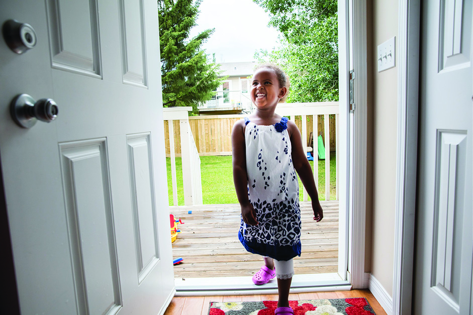 Child walking through door