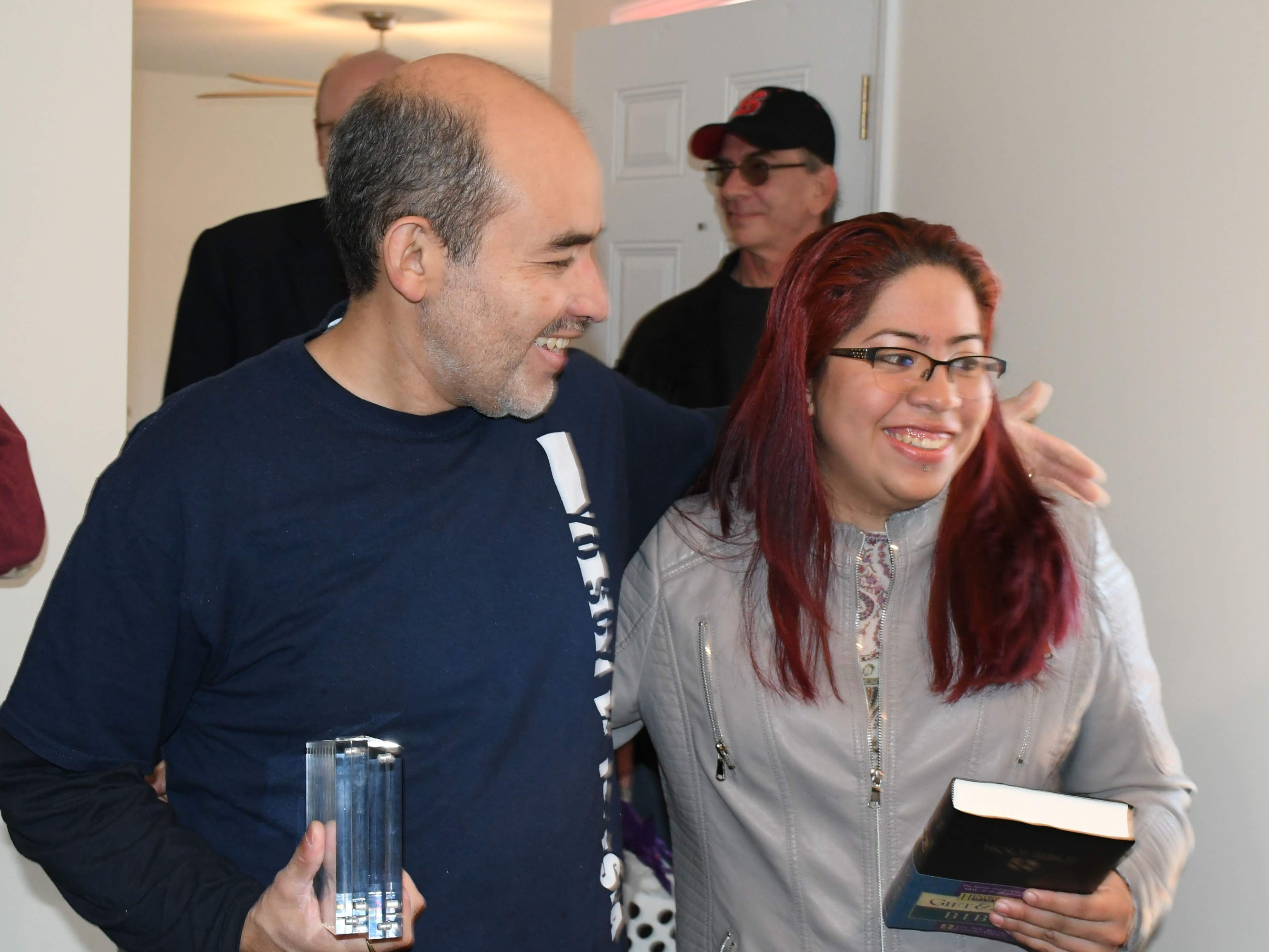 Pastor Jose Luis Villasenor and homebuyer Lissethe at her home dedication.