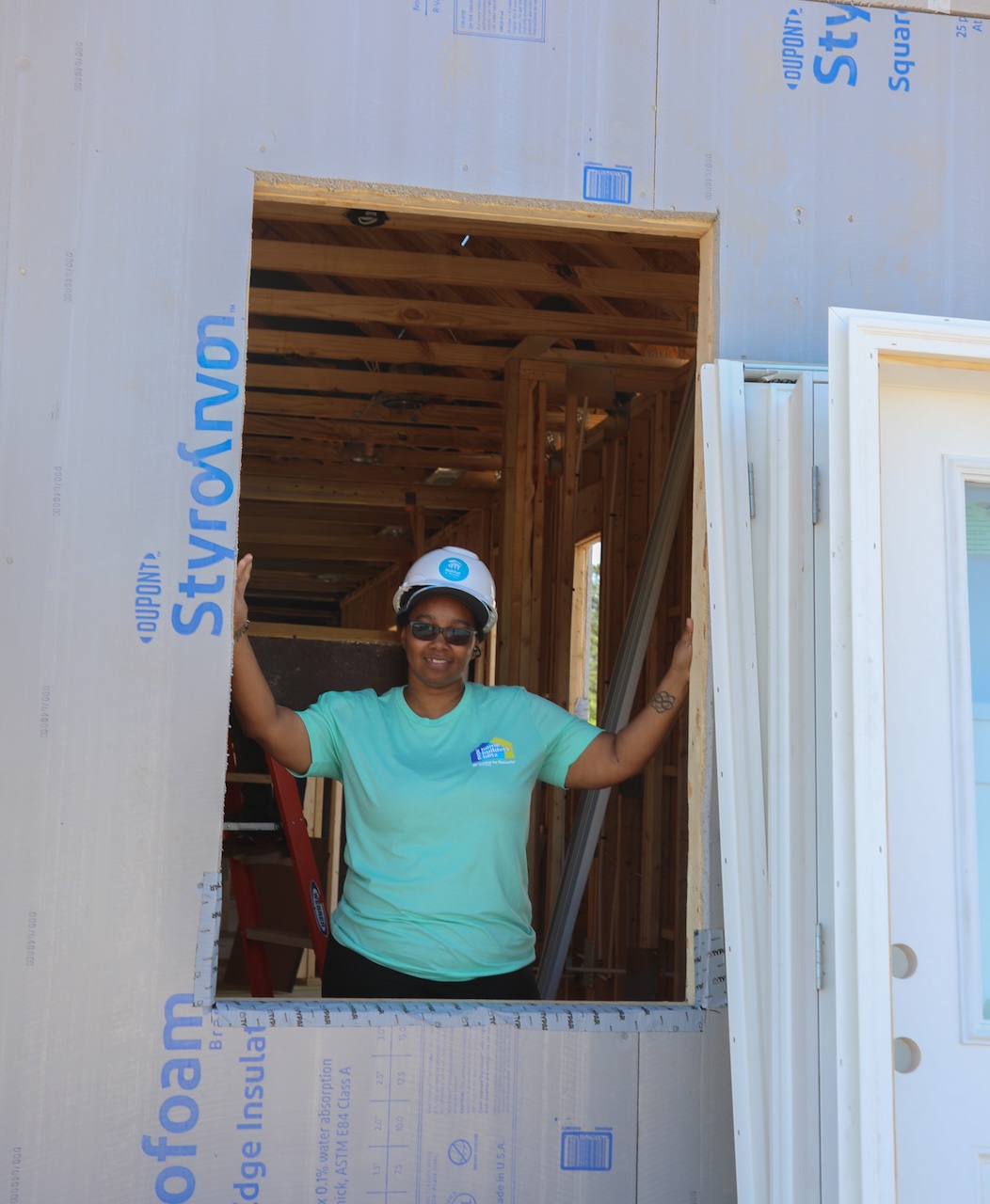Homebuyer looking through window