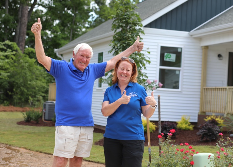 Builders Blitz founder Tom Gipson with Habitat Wake CEO Patricia Burch